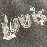 Flat lay presentation of Louis Vuitton luxury clothing with signature branding