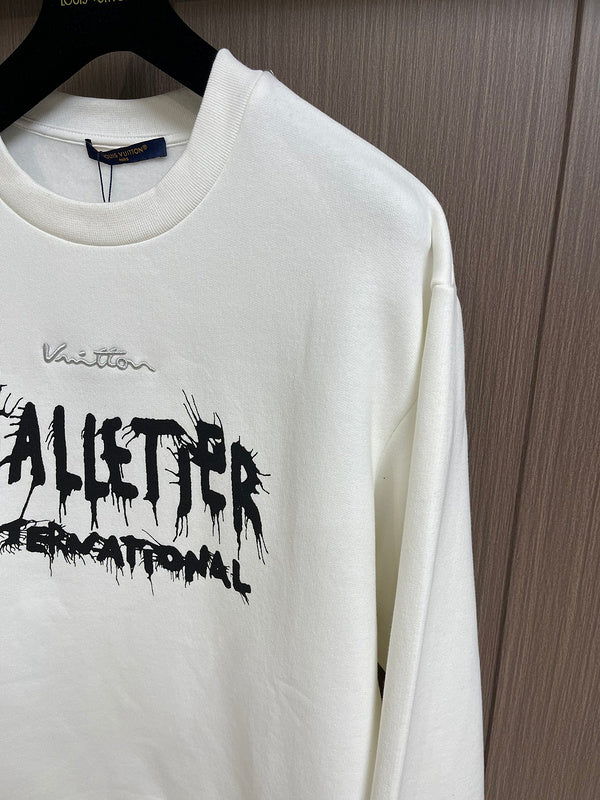 Full styled look of Louis Vuitton luxury clothing with signature branding