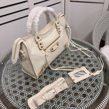 Handle and strap detail of modern statement women's handbag – women's luxury accessory
