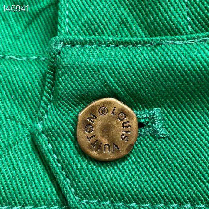 Flat lay presentation of Louis Vuitton luxury clothing with tailored silhouette