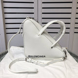 Handle and strap detail of chic polished women's handbag – women's designer-style accessory