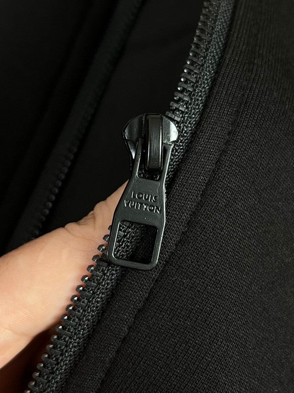 Back view of Louis Vuitton luxury clothing with label-forward styling