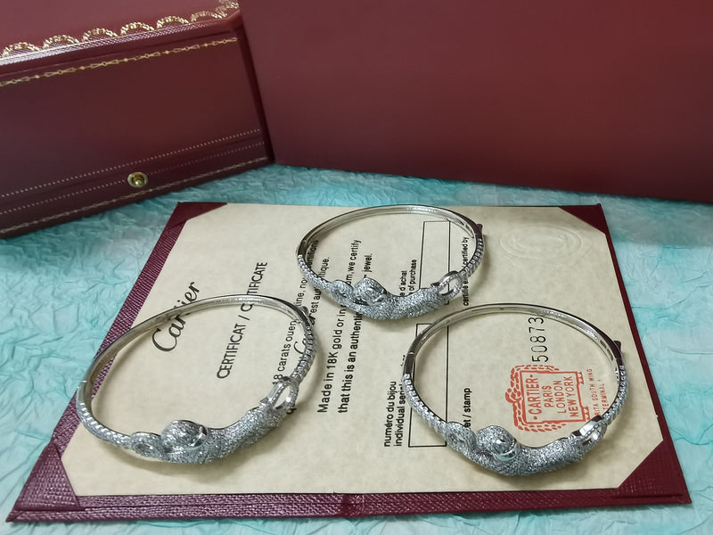 Front view of Cartier unisex jewelry piece