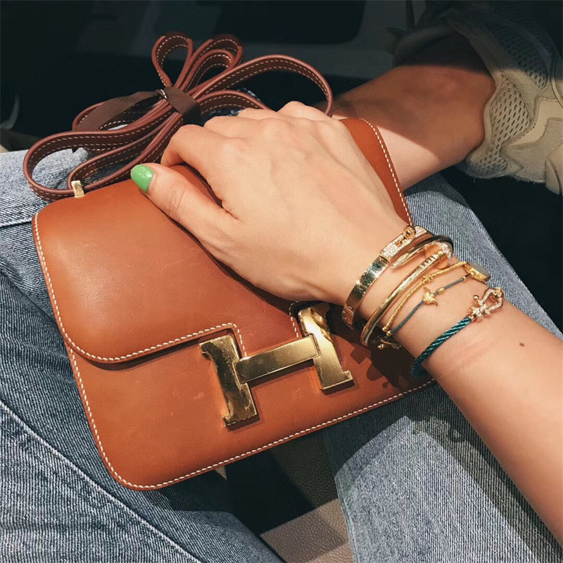  Polished satchel carried on shoulder