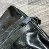 Styled lifestyle shot of structured polished women's handbag – women's statement bag