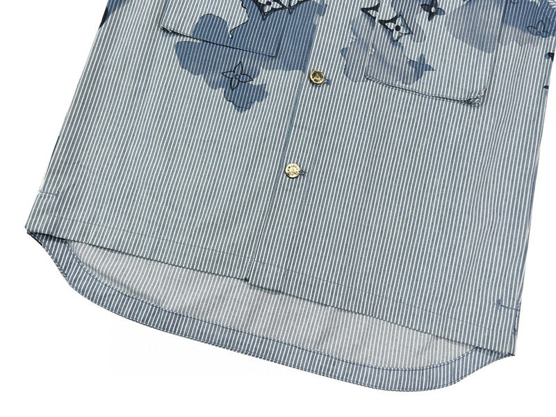 Flat lay presentation of Louis Vuitton luxury clothing with runway-inspired design