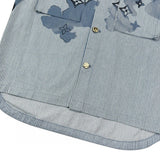 Flat lay presentation of Louis Vuitton luxury clothing with runway-inspired design