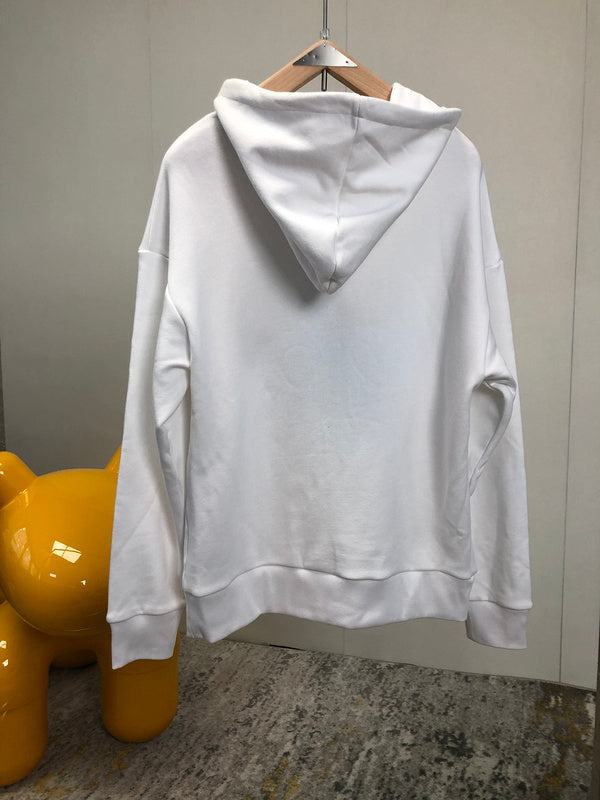 Side profile of Gucci luxury clothing with label-forward styling
