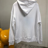 Side profile of Gucci luxury clothing with label-forward styling