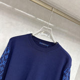 Flat lay presentation of Louis Vuitton luxury clothing with contemporary cut