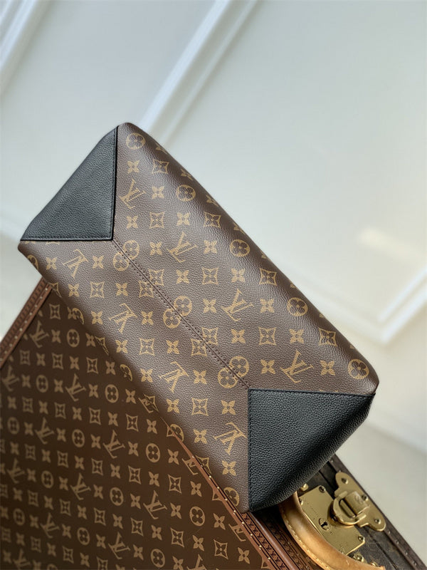  Contemporary top-handle bag carried on shoulder
