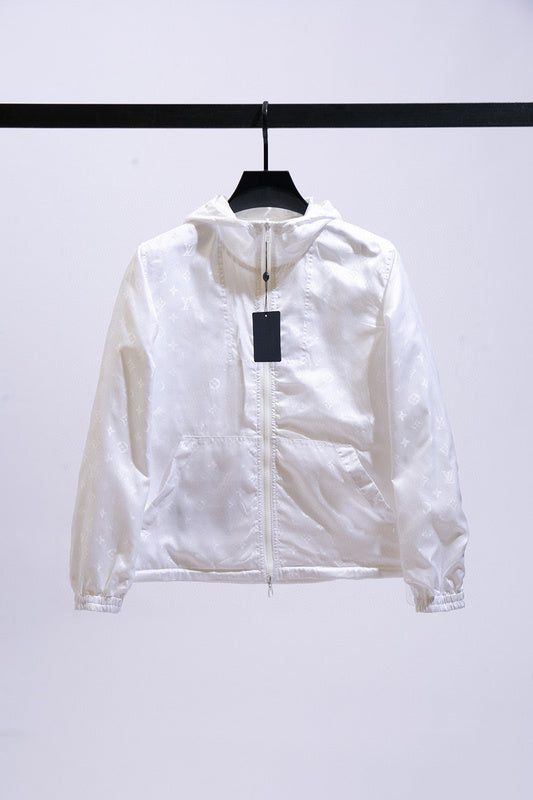 Close-up detail shot of Louis Vuitton luxury clothing with label-forward styling