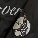 Full styled look of Louis Vuitton luxury clothing with label-forward styling
