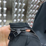 Close-up detail shot of Louis Vuitton luxury clothing with everyday silhouette