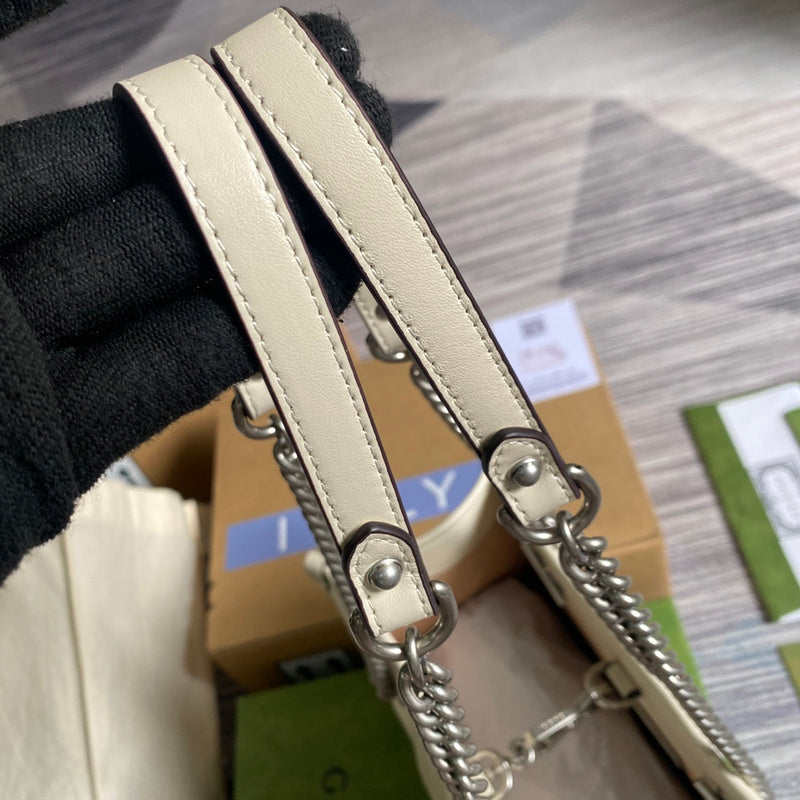 Styled lifestyle shot of modern polished women's handbag – women's luxury accessory