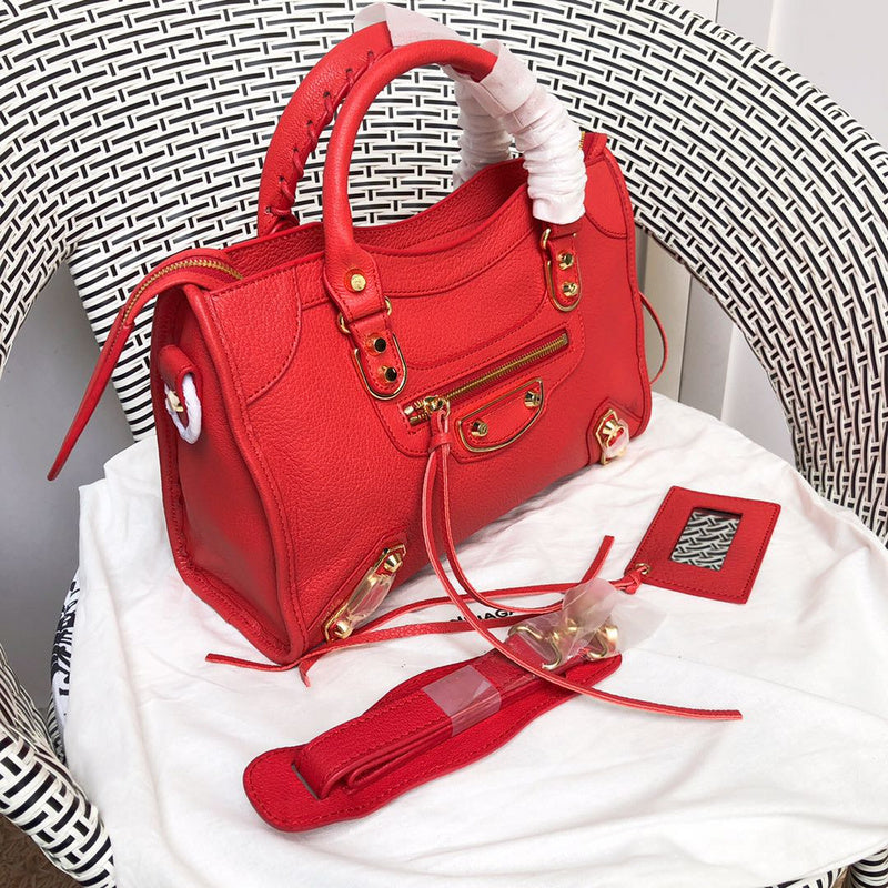 Handle and strap detail of statement polished women's handbag – women's designer-style accessory