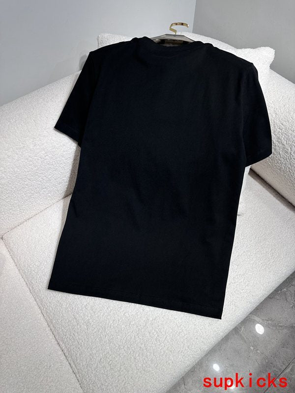 Flat lay presentation of Moncler luxury clothing with monogram-inspired silhouette