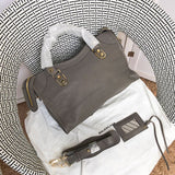 Top view of sleek polished women's handbag – women's luxury accessory
