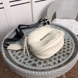 Handle and strap detail of everyday-luxe signature women's handbag – women's luxury accessory