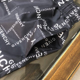 Close-up detail shot of Givenchy luxury clothing with signature branding