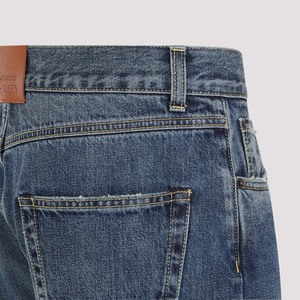 Close-up of Alexander McQueen pants hardware and fine stitching