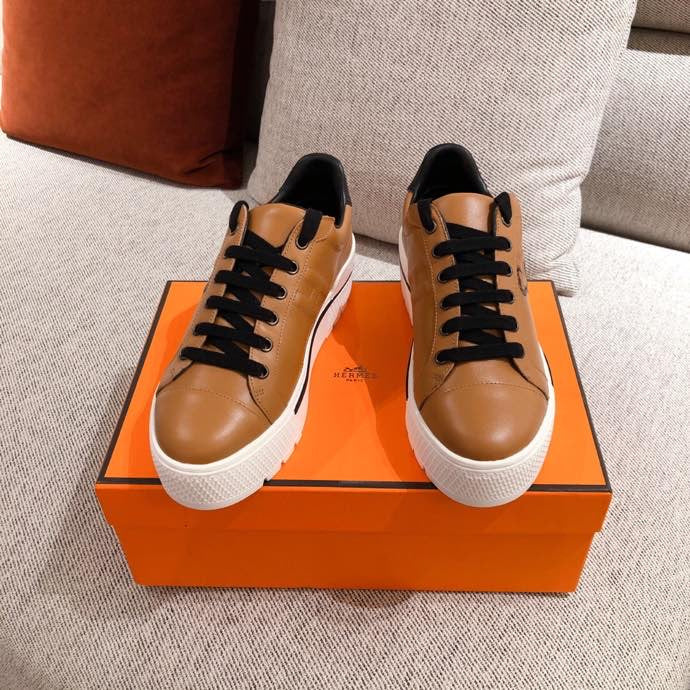 Hermes shoes Style 393 - close-up of statement logo accent