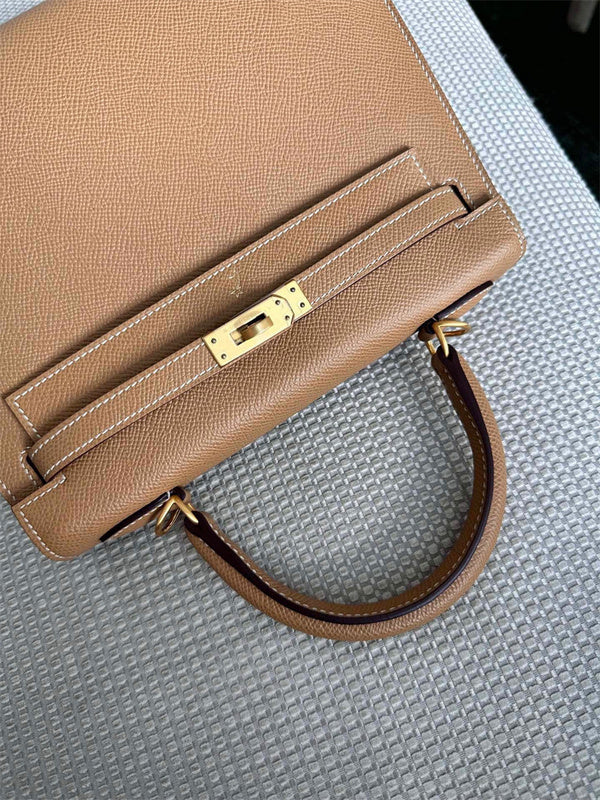  Streamlined top-handle bag carried on shoulder