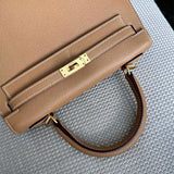  Streamlined top-handle bag carried on shoulder
