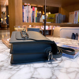 Side view of understated structured handbag