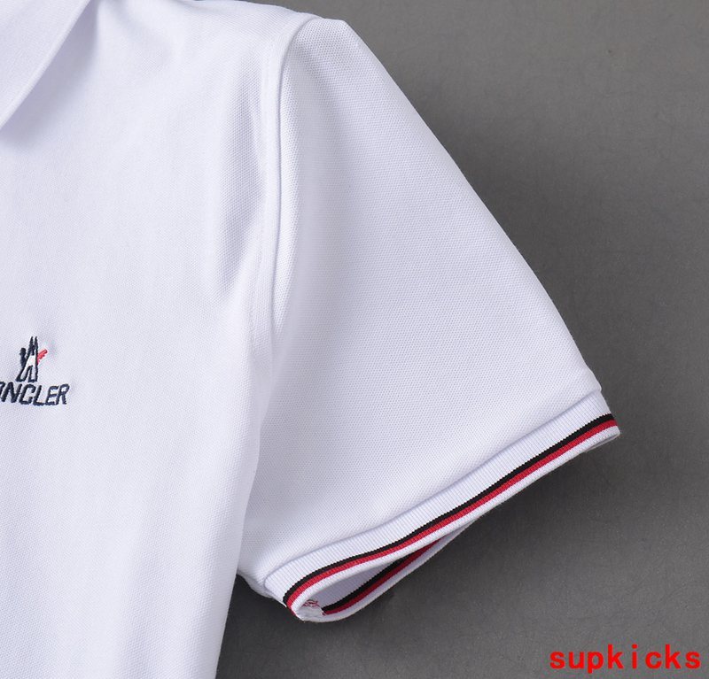 Flat lay presentation of Moncler luxury clothing with logo-detail design