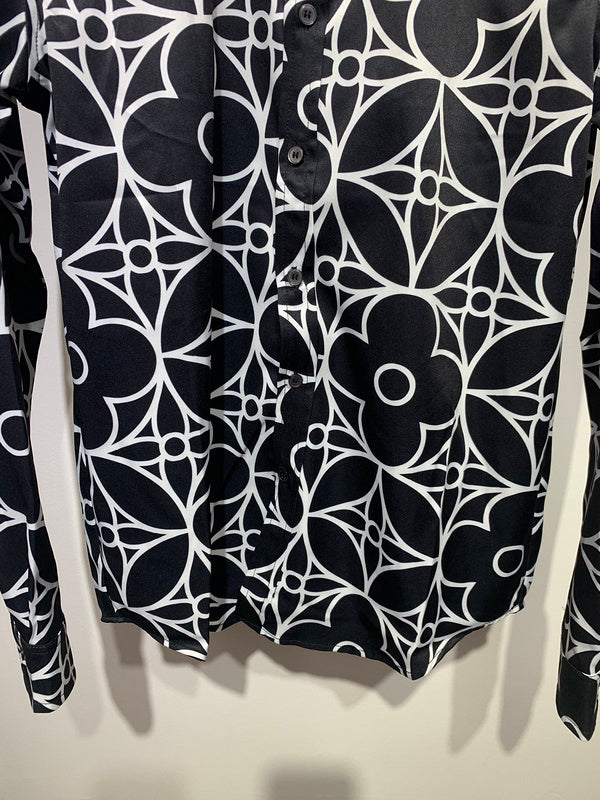Flat lay presentation of Louis Vuitton cotton t-shirt with signature branding