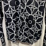 Flat lay presentation of Louis Vuitton cotton t-shirt with signature branding