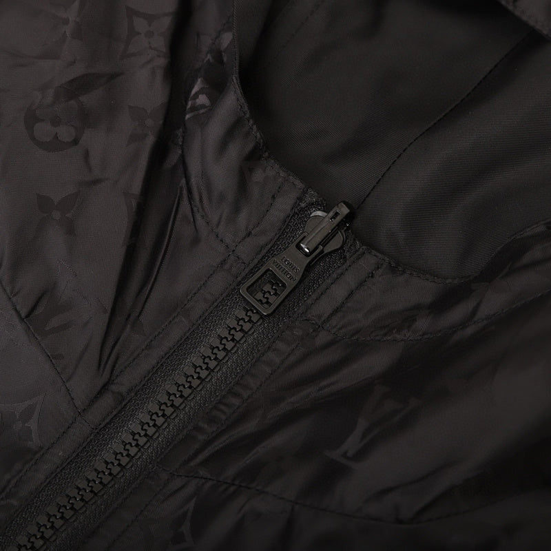 Close-up detail shot of Louis Vuitton luxury clothing with logo-detail design
