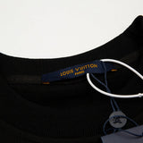Front view of Louis Vuitton luxury clothing with signature branding