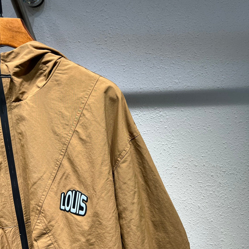 Full styled look of Louis Vuitton luxury clothing with label-forward styling