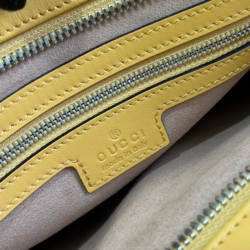 Side profile of chic signature women's handbag – women's luxury accessory
