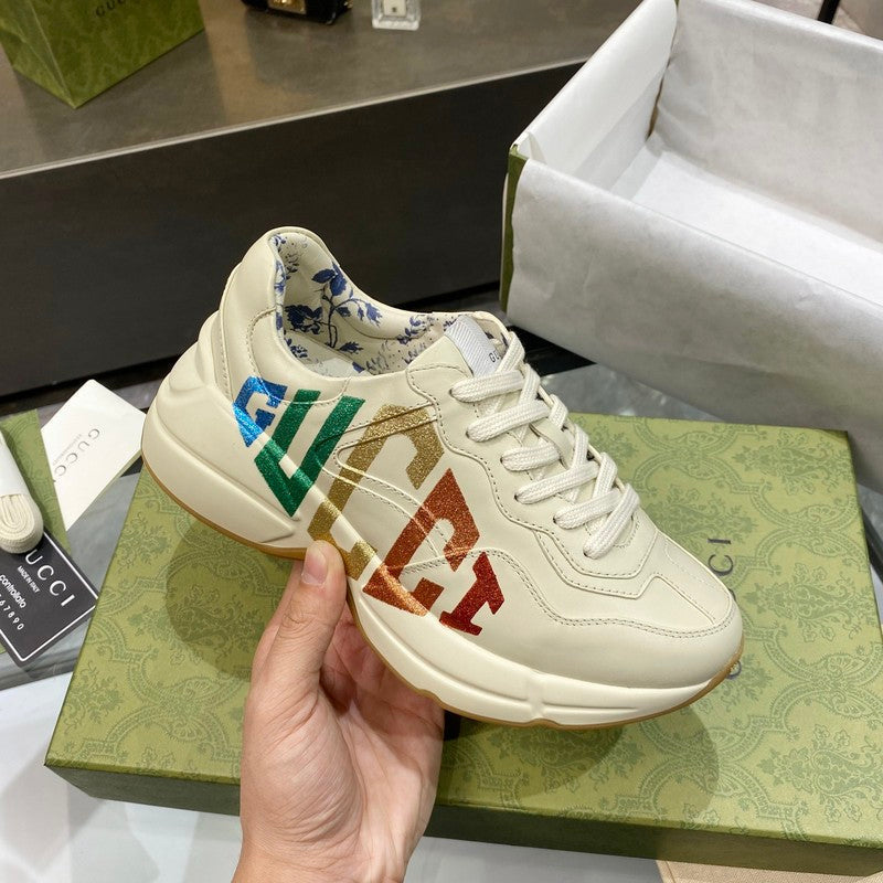 Side profile of Gucci fresh white-and-black sneakers signature lace-up style