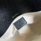 Styled lifestyle shot of structured statement women's handbag – women's statement bag