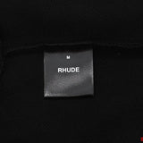 Side profile of Rhude luxury clothing with streetwear-inspired cut