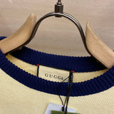 Close-up detail shot of Gucci luxury clothing with label-forward styling
