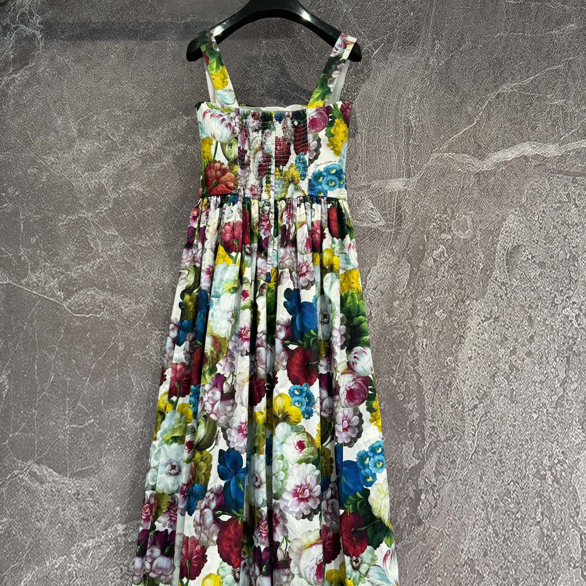Dolce & Gabbana Dress flat lay on neutral background