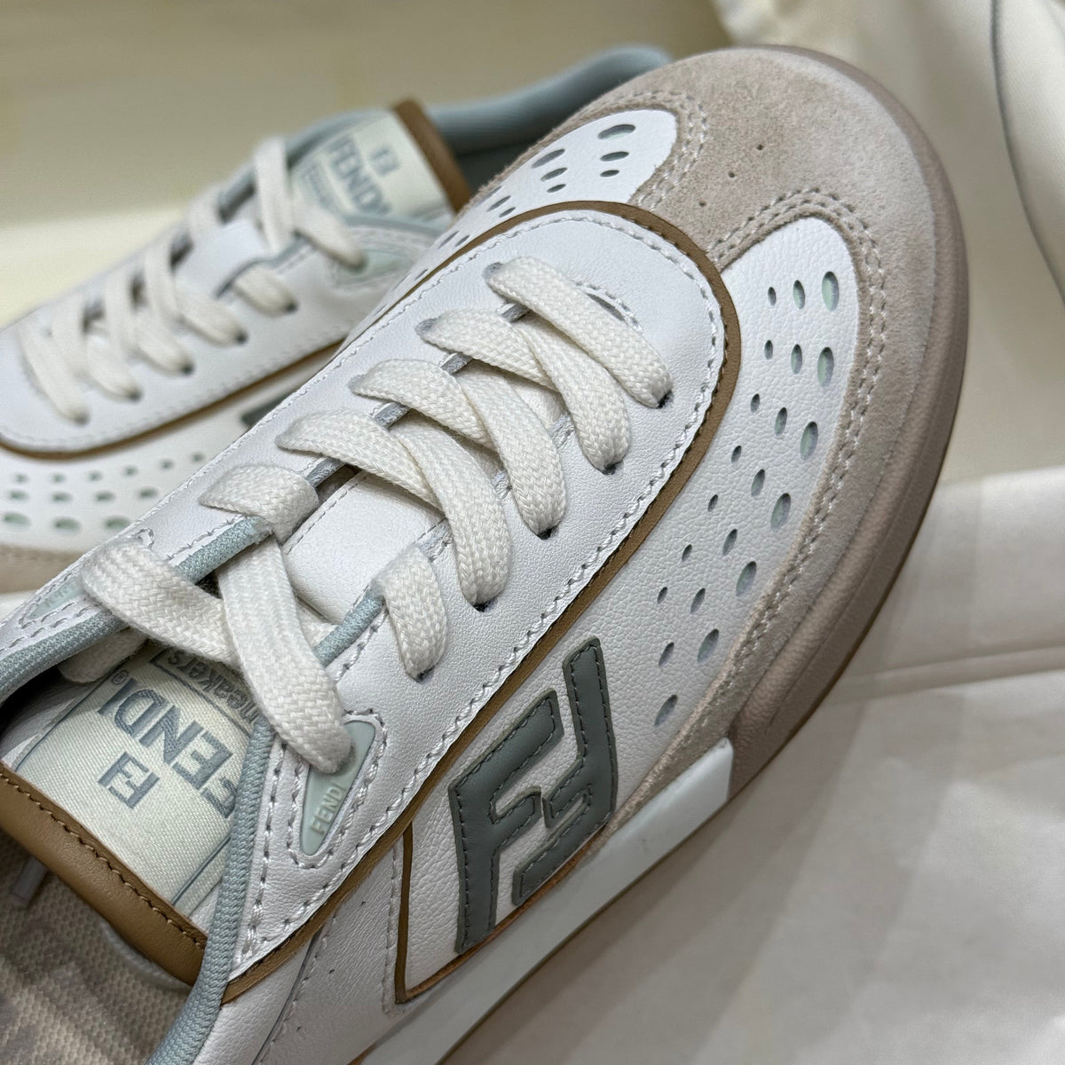 Close-up of Fendi Sneakers signature hardware and stitching detail