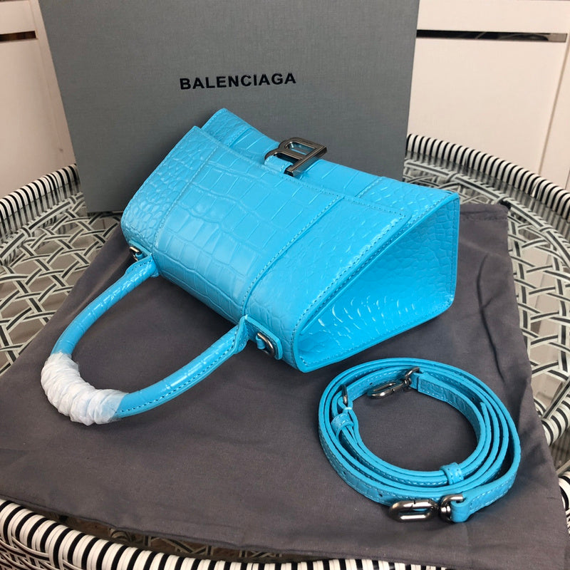 Styled lifestyle shot of modern structured women's handbag – women's luxury handbag