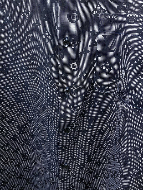 Flat lay presentation of Louis Vuitton luxury clothing with label-forward styling