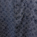 Flat lay presentation of Louis Vuitton luxury clothing with label-forward styling