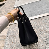 Side view of statement structured handbag