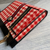 Handle and strap detail of elevated polished women's handbag – women's designer-style accessory
