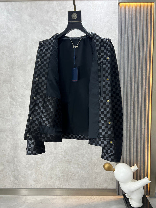Close-up detail shot of Louis Vuitton luxury clothing with label-forward styling