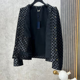 Close-up detail shot of Louis Vuitton luxury clothing with label-forward styling