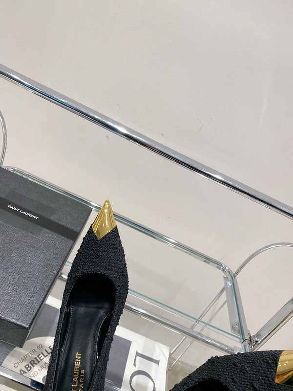 Three-quarter angle view of Saint Laurent luxury piece style No.002